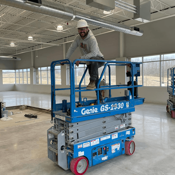 White Light Electric team working from an elevated scissor lift.